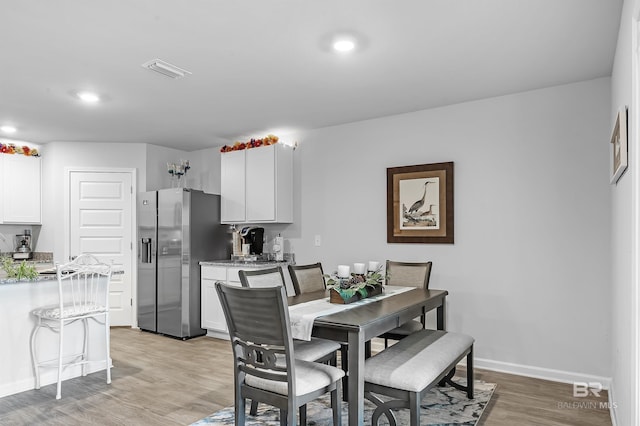 20770 Mercury Dr, Robertsdale, AL 36567 - dining space with light wood-style flooring and recessed lighting