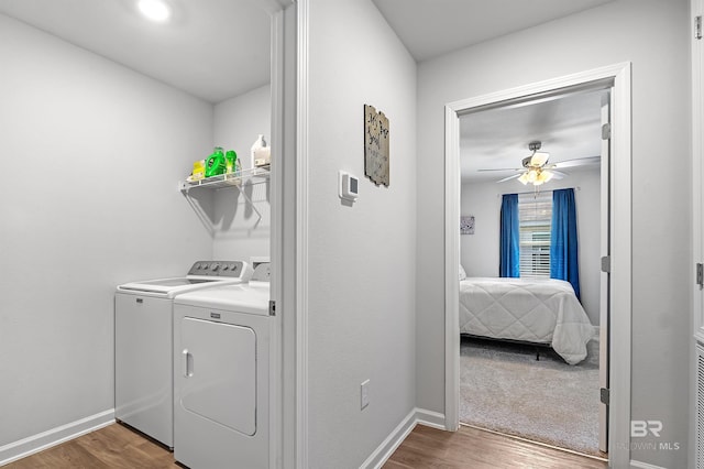 20770 Mercury Dr, Robertsdale, AL 36567 - laundry area with washing machine and clothes dryer, wood finished floors, and ceiling fan