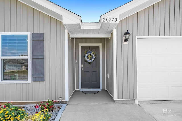 20770 Mercury Dr, Robertsdale, AL 36567 - entrance to property with an attached garage and board and batten siding
