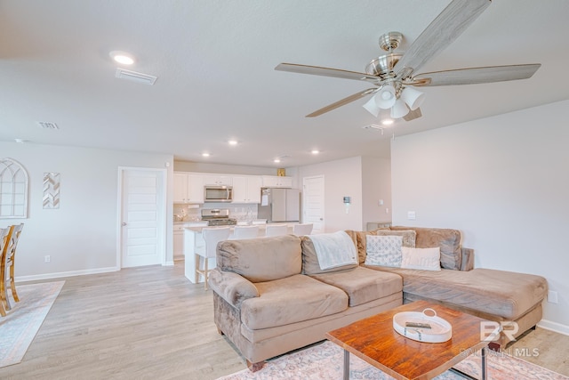 8242 Sycamore Way, Semmes, AL 36575 - living room with light wood-style floors, a ceiling fan, and recessed lighting