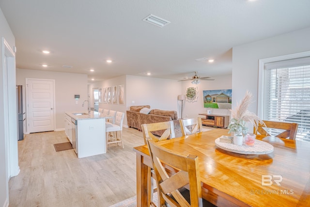 8242 Sycamore Way, Semmes, AL 36575 - dining space featuring light wood-type flooring, a ceiling fan, and recessed lighting