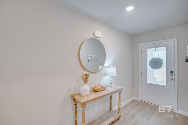 8242 Sycamore Way, Semmes, AL 36575 - entryway featuring light wood-style flooring and baseboards