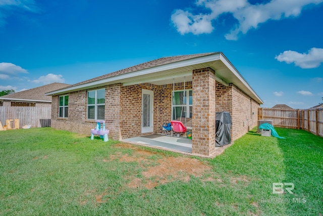 8242 Sycamore Way, Semmes, AL 36575 - back of property with brick siding, a fenced backyard, and a patio area