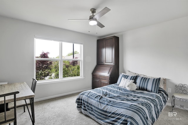 bedroom featuring ceiling fan and light colored carpet