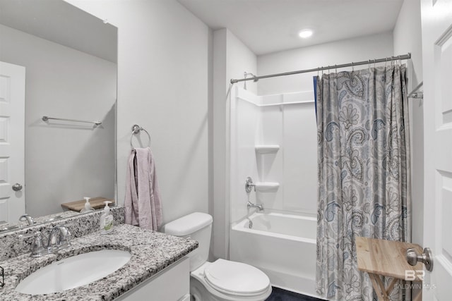 full bathroom with shower / bath combo with shower curtain, vanity, and toilet