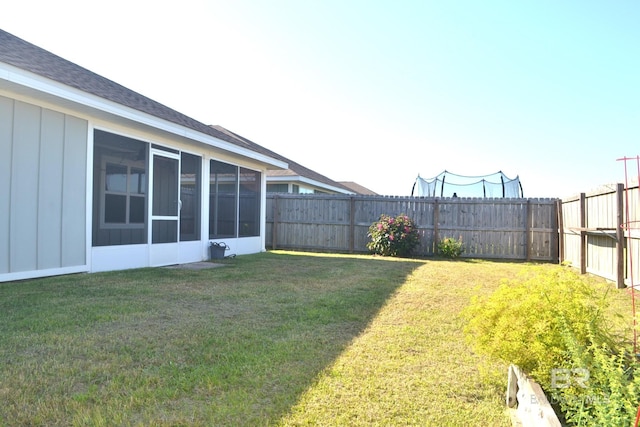 view of yard featuring a sunroom