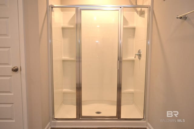 bathroom featuring an enclosed shower