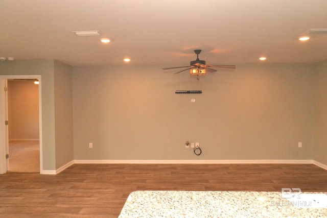 unfurnished room with ceiling fan and hardwood / wood-style flooring