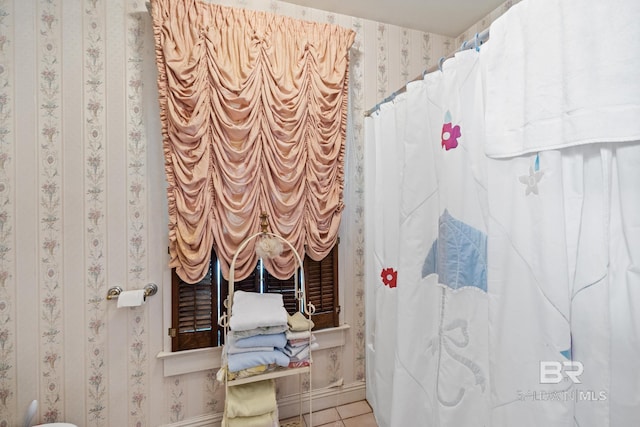 bathroom with tile patterned floors