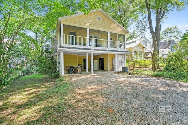 back of house featuring central AC unit