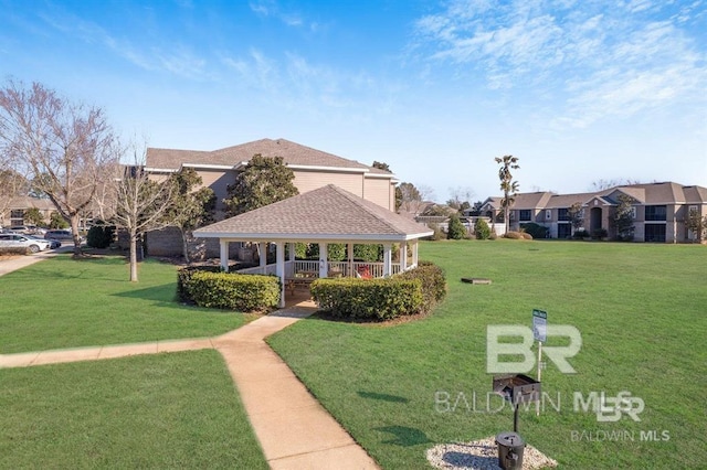 surrounding community with a gazebo and a lawn