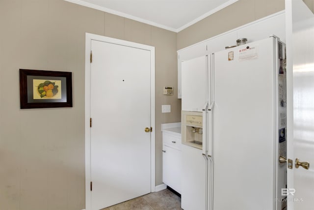 interior space featuring light tile patterned floors and crown molding