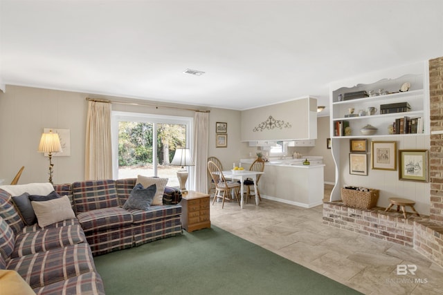 living room featuring visible vents