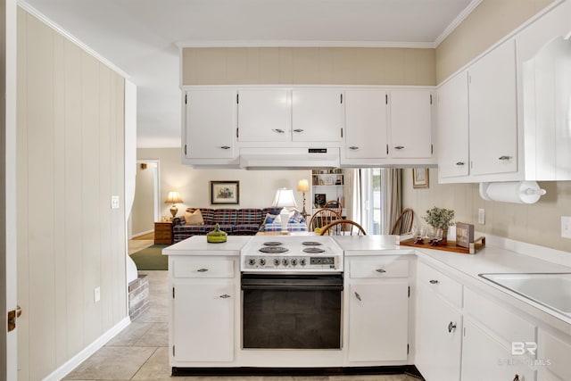 kitchen with electric stove, under cabinet range hood, a sink, white cabinets, and light countertops