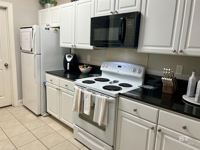 kitchen featuring white cabinetry, white appliances, and light tile patterned flooring