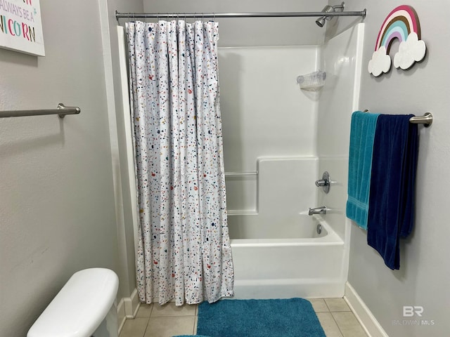 bathroom with tile patterned flooring, shower / bath combo, and toilet