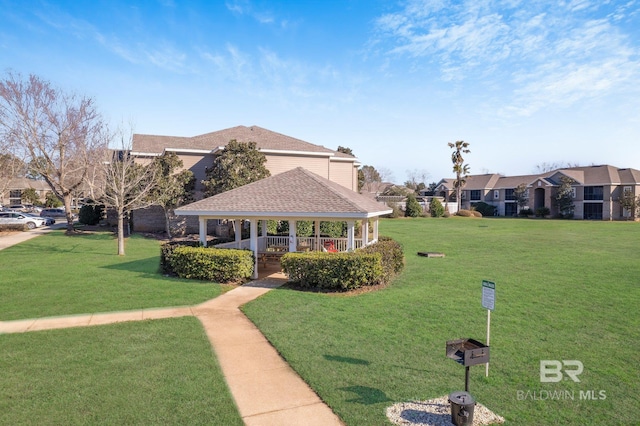 surrounding community with a gazebo and a lawn