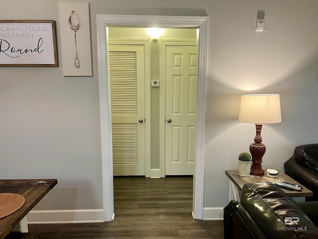 hall with dark wood-type flooring