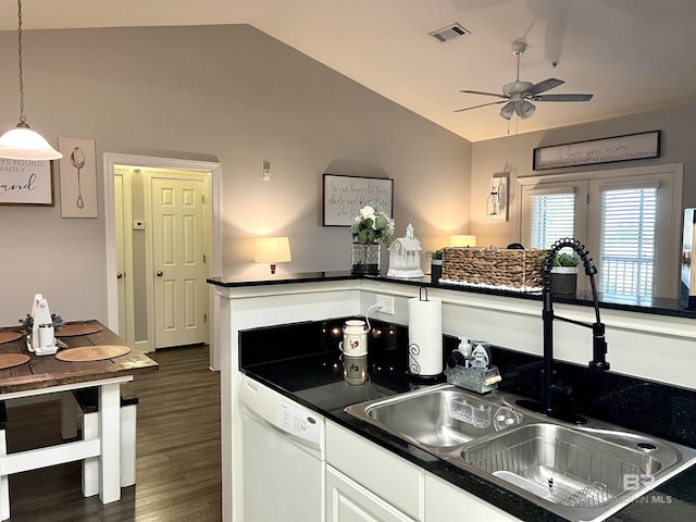 kitchen with sink, white dishwasher, white cabinets, decorative light fixtures, and vaulted ceiling