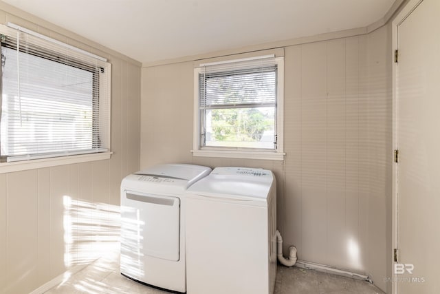 clothes washing area featuring laundry area and separate washer and dryer