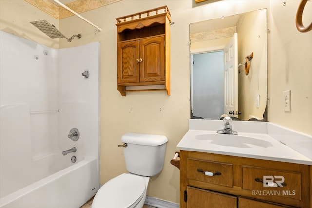 bathroom featuring toilet, tub / shower combination, and vanity