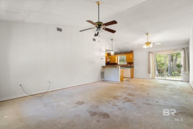 unfurnished living room with visible vents, ceiling fan, lofted ceiling, and unfinished concrete flooring