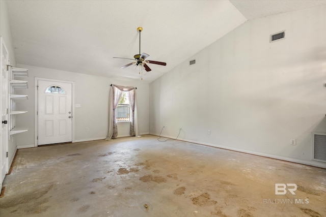 entrance foyer with visible vents, ceiling fan, lofted ceiling, and unfinished concrete floors