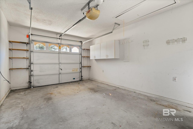 garage featuring baseboards and a garage door opener