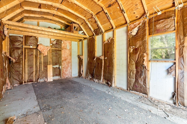 miscellaneous room with lofted ceiling