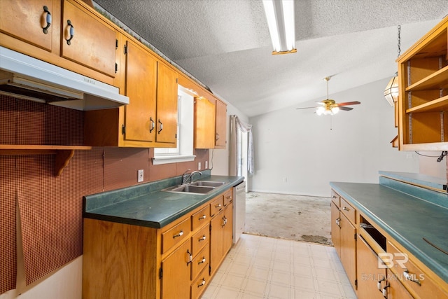 kitchen with ceiling fan, dark countertops, dishwasher, a sink, and lofted ceiling