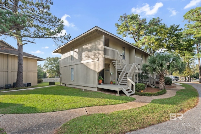 view of home's exterior with a yard