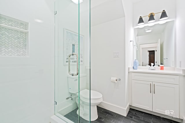 bathroom with tile flooring, toilet, and vanity