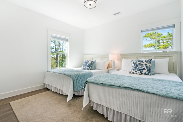 bedroom featuring dark wood-type flooring