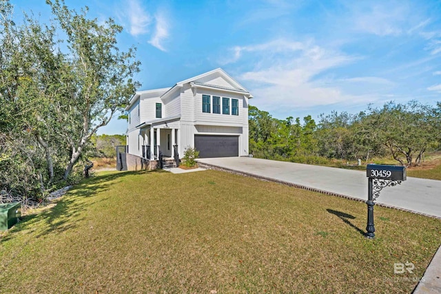 view of front of home with a front yard and a garage