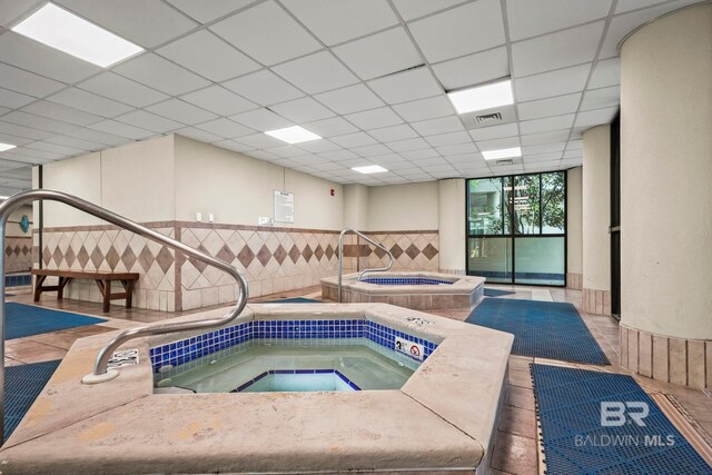 view of pool with an indoor in ground hot tub