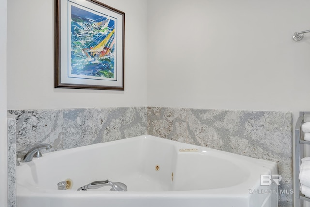 full bath featuring a tub with jets