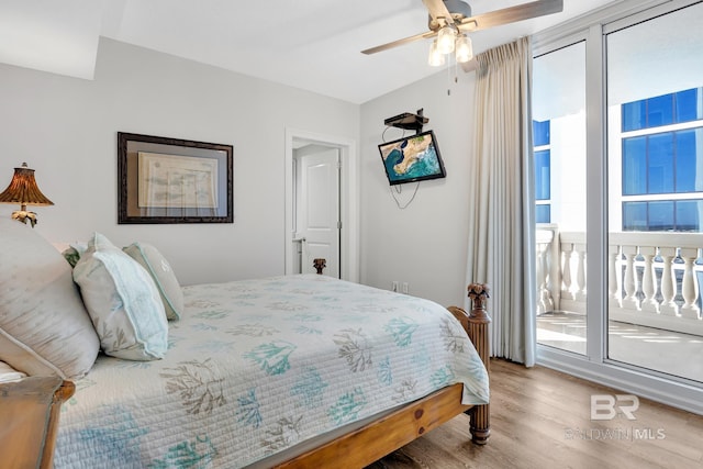 bedroom with wood finished floors, a ceiling fan, and access to exterior