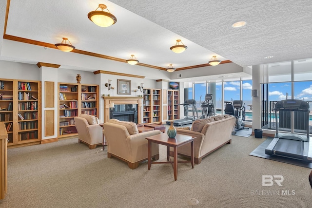 living area featuring a wall of windows, a high end fireplace, carpet flooring, and a textured ceiling