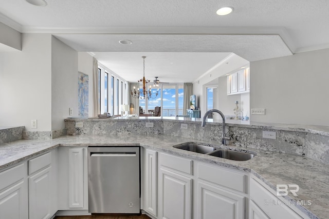 kitchen featuring a chandelier, dishwasher, light stone countertops, white cabinetry, and a sink