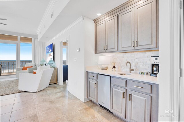 26688 Perdido Beach Blvd Unit 505, Orange Beach, AL 36561 - kitchen featuring tasteful backsplash, a sink, ornamental molding, light countertops, and stainless steel dishwasher