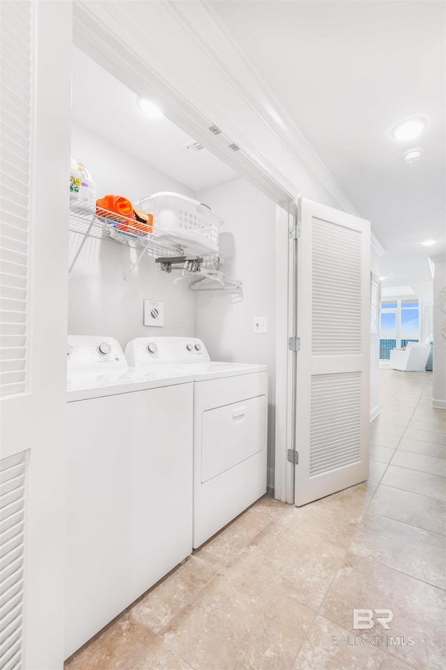 26688 Perdido Beach Blvd Unit 505, Orange Beach, AL 36561 - laundry area featuring laundry area, ornamental molding, and washing machine and dryer
