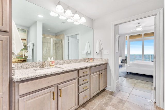 26688 Perdido Beach Blvd Unit 505, Orange Beach, AL 36561 - ensuite bathroom with ceiling fan, a shower stall, ensuite bath, a sink, and double vanity