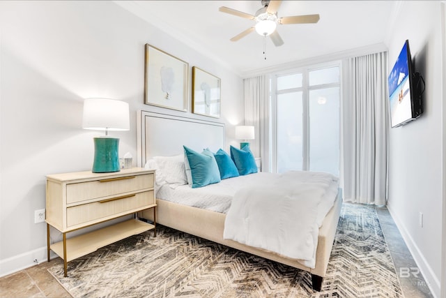 26688 Perdido Beach Blvd Unit 505, Orange Beach, AL 36561 - bedroom featuring crown molding, baseboards, and a ceiling fan