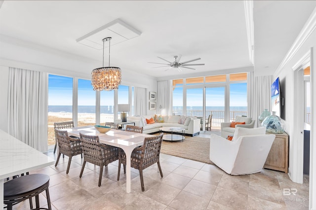 26688 Perdido Beach Blvd Unit 505, Orange Beach, AL 36561 - dining room with ceiling fan with notable chandelier, light tile patterned floors, and ornamental molding