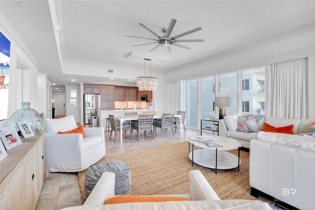 26688 Perdido Beach Blvd Unit 505, Orange Beach, AL 36561 - living room with recessed lighting, plenty of natural light, ceiling fan with notable chandelier, and ornamental molding