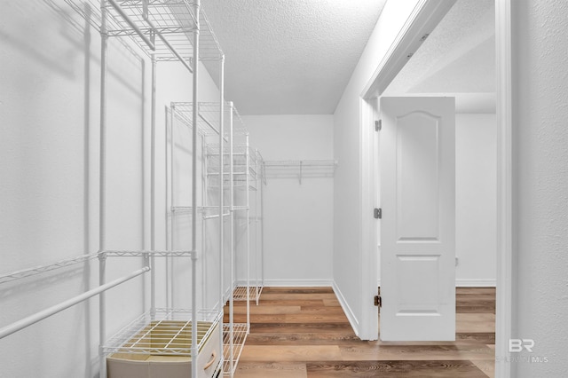 6950 Summerset Dr, Gulf Shores, AL 36542 - spacious closet featuring wood finished floors