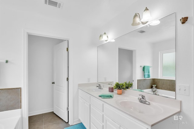 6950 Summerset Dr, Gulf Shores, AL 36542 - bathroom with double vanity, a garden tub, and tile patterned floors