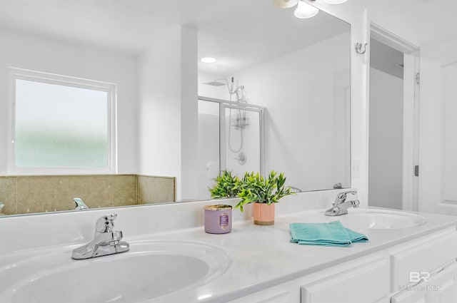 6950 Summerset Dr, Gulf Shores, AL 36542 - bathroom featuring double vanity and a shower stall