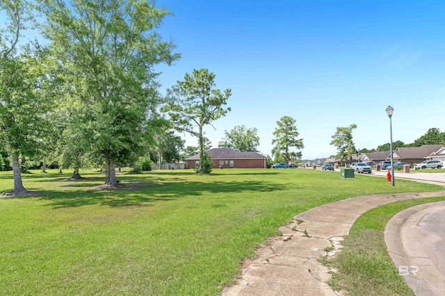 6950 Summerset Dr, Gulf Shores, AL 36542 - view of grassy yard with a residential view