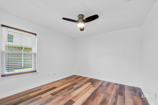 6950 Summerset Dr, Gulf Shores, AL 36542 - spare room with wood finished floors, a ceiling fan, and baseboards